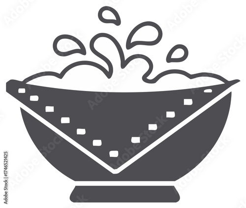 Splash bowl overflowing with liquid and a decorative bandana edge