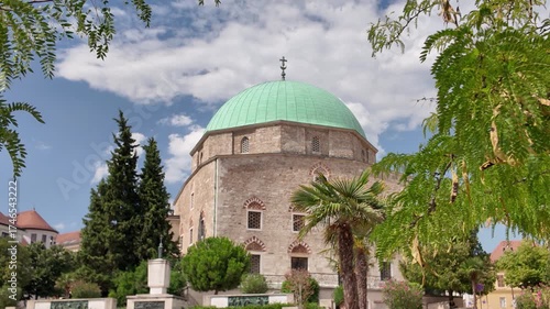 Wallpaper Mural Exterior view of the Mosque of Pasha Qasim in Pécs, beautifully framed by a tree, highlighting its ornate architecture and historic charm Torontodigital.ca