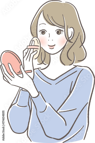 化粧をする笑顔の女性