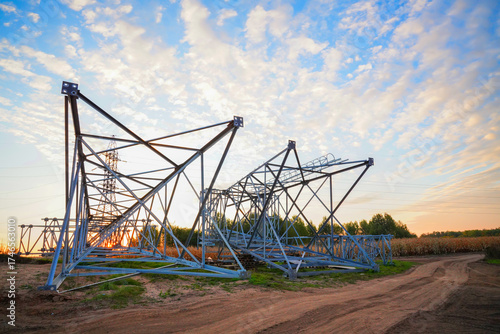 Electric tower construction. Power Tower Transmission Lines. High voltage electricity, Electrical Power Tower repair. Electric towers installation. Construction of high voltage power lines.