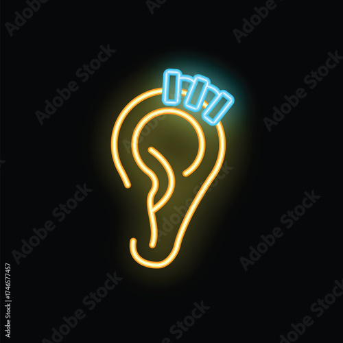 Yellow neon sign representing an ear with three blue piercing studs on a black background