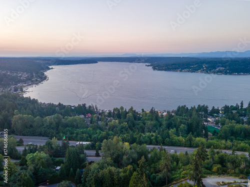 Aerial landscape of Lake Washington forest and mountains at sunset Bellevue suburb of Seattle WA