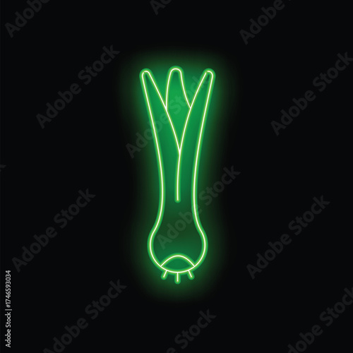 Green neon sign showing a leek vegetable, an element of french cuisine, on a black background