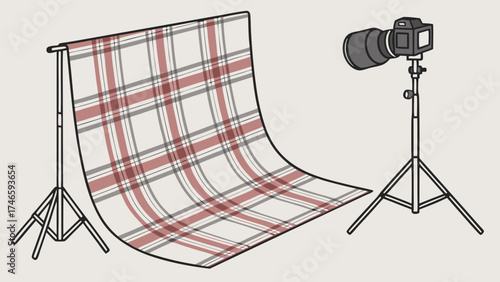 Studio Photography Setup with Plaid Backdrop and Camera on Tripod.