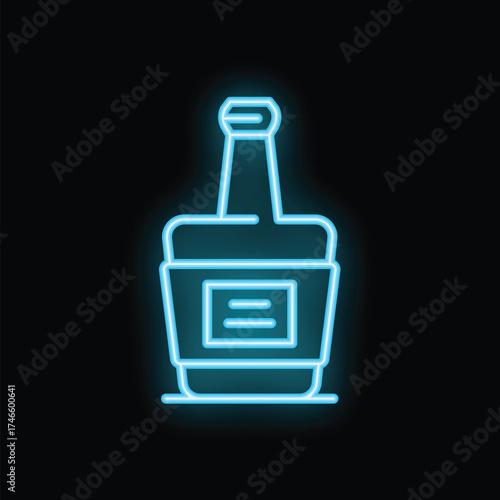 Neon blue glass bottle with blank label is shining on black background