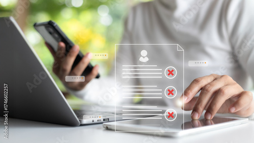 Foto Digital data verification concept showing a person using a smartphone and a tablet with rejection symbols, representing account denial, online review, and cybersecurity access control