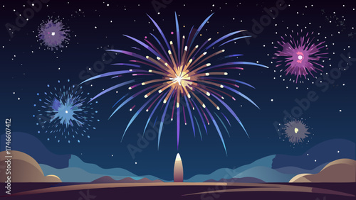 Colorful fireworks explode in the night sky above a silhouetted landscape