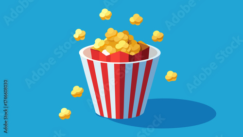 Classic red and white striped popcorn bucket overflowing with popcorn