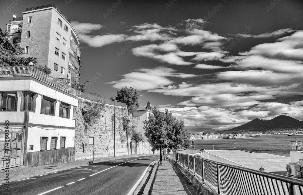 Fototapeta premium Scenic view of Mergellina seafront in Naples with calm sea and sunset colors