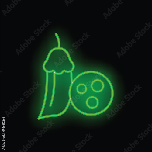 Green neon sign showing a piece of okra and falafel on a black background