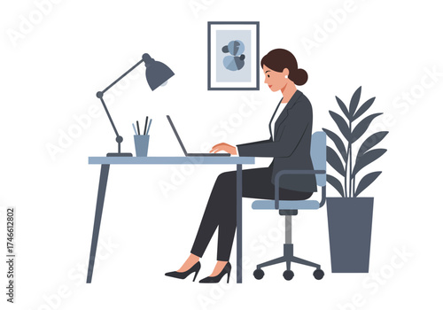 Woman in a suit sits at a desk using a laptop in a welllit office setting
