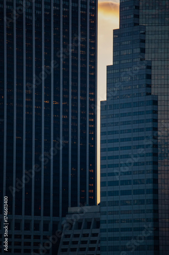 New York, Usa: aerial view and skyline at sunset on Lower Manhattan with iconic skyscrapers, details of the 111 Wall Street, famous building in Financial District built in 1966 

