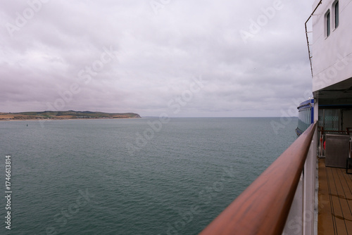 Sailing out from the Ferry Port and Harbour at Dover heading for France - showing the Port, Harbour entrance and breakwater.