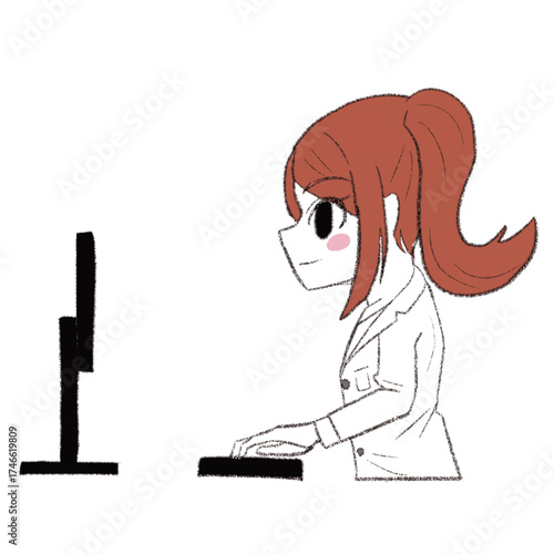 白衣を着た女の子がパソコンを使っている