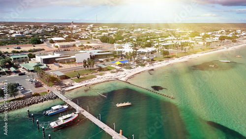 Aerial view of Denham town in Western Australia with coastline and turquoise waters on sunny day