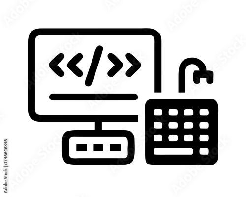 Computer screen showing code with keyboard