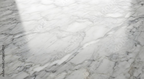Closeup of a white marble surface with grey veins