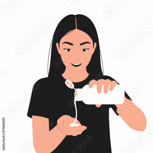 A young woman with long black hair pouring white lotion from a bottle into her hand against a white background.