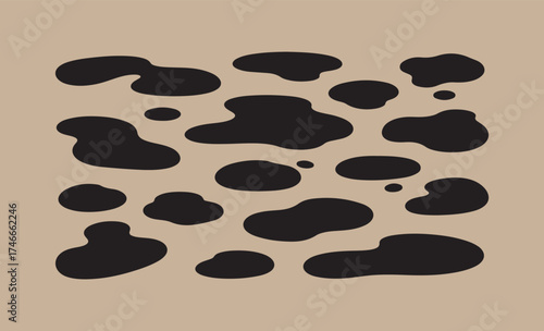 Abstract black organic shapes on a beige background pattern