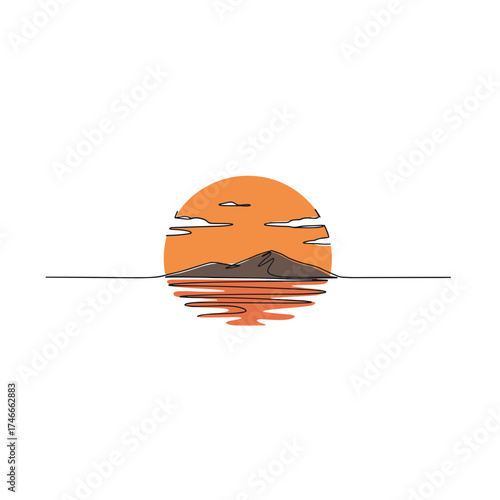 Sunset over mountain silhouette reflected in calm water  