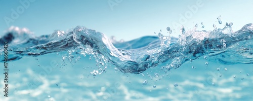 Close-up of clear blue water with gentle waves and splashes in natural setting