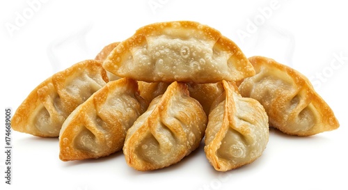 Crispy fried dumplings goldenbrown and folded stacked on a white surface