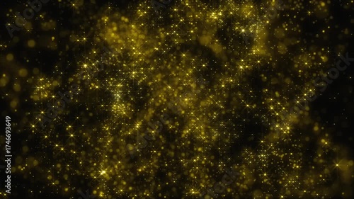 Abstract golden background filled with glitter, shine, and shimmer. Stars or sparks scattered throughout the video. Abstract golden glow with many flickering dots.