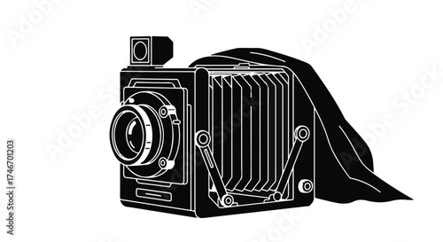 Vintage bellows camera with draped fabric, evoking nostalgia and classic photography.