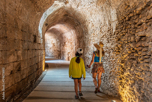 Mom and daughter, on summer vacation, in Spain, in the underground section of the Teatro Romano de Cádiz or Roman Theater of Cádiz.  