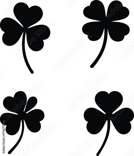 Four black clover silhouettes symbolizing luck and st patricks day celebration