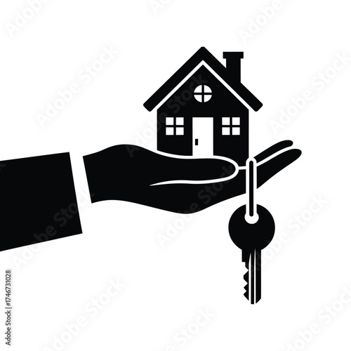 Hand holding a house and key representing home ownership and real estate