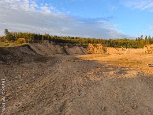 Abandoned mining quarry. Sand pit in the evening light.