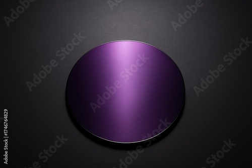 Polished purple semiconductor wafer with metallic sheen on a dark background