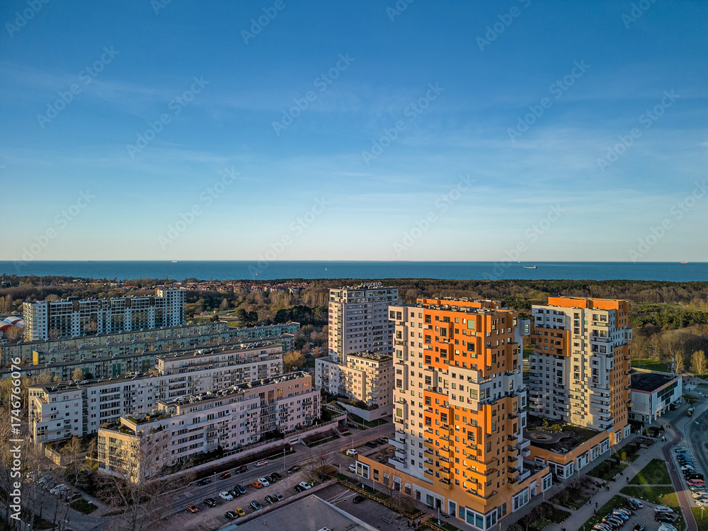 Fototapeta premium Wide aerial HDR panorama of Przymorze residential blocks and Baltic coast in Gdansk during late afternoon emphasizing urban layout