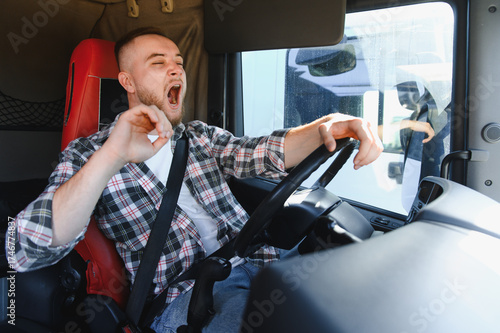 Obraz na plátne Truck driver yawning experiencing fatigue and drowsiness