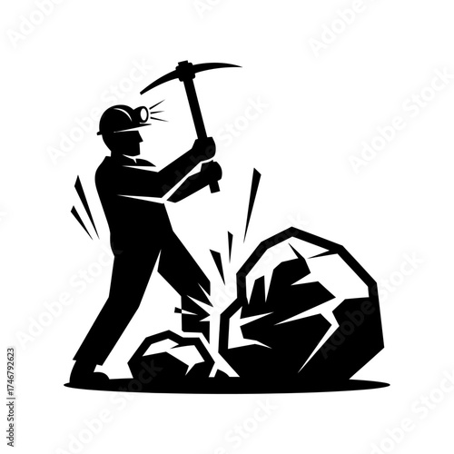 Miner at Work - Silhouette of a Coal Miner Breaking Rock.