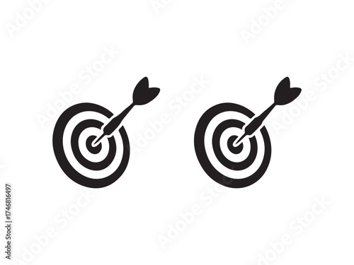 Two dartboards with darts hitting the bullseye