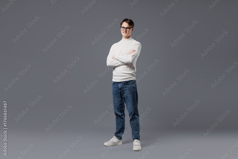Fototapeta premium Man in stylish jeans on grey background
