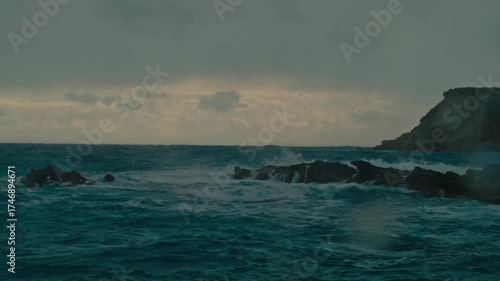 Stormy weather with birds flying over the sea