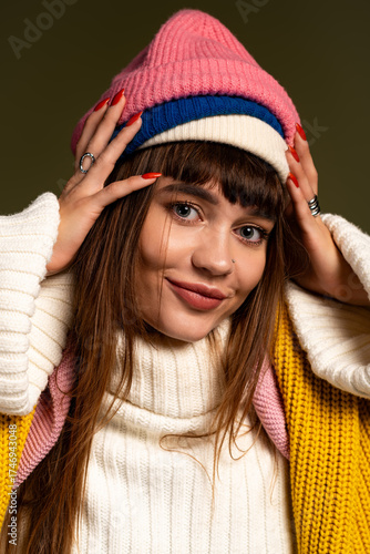 Wallpaper Mural Young woman showcases warm autumn style with colorful hat and cozy attire Torontodigital.ca