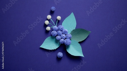 Artistic paper flower arrangement on purple background
