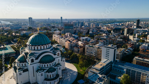 Aerial view of Temple of Saint Sava on Vračar hill with Belgrade Waterfront at sunset