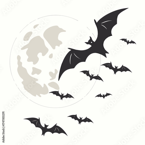 Black bats flying in front of a pale full moon night