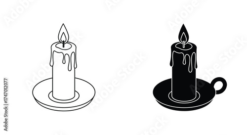 Two burning candles in different styles one light and one dark