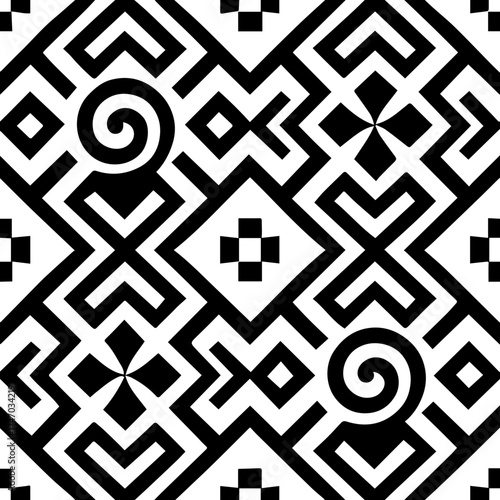 Intricate black and white geometric pattern with spiral motifs