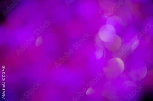 Purple  glow. Abstract background. Light and bokeh. Abstraction circles on a black background.