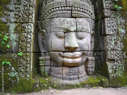 Wallpaper Mural Ancient Stone Face Carvings at Angkor Thom, Cambodia: A journey through history and art Torontodigital.ca