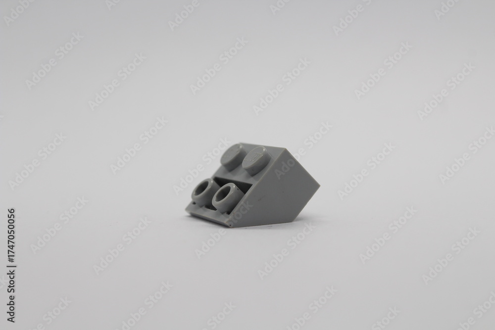 Obraz premium Grey Lego brick piece isolated on a white background 