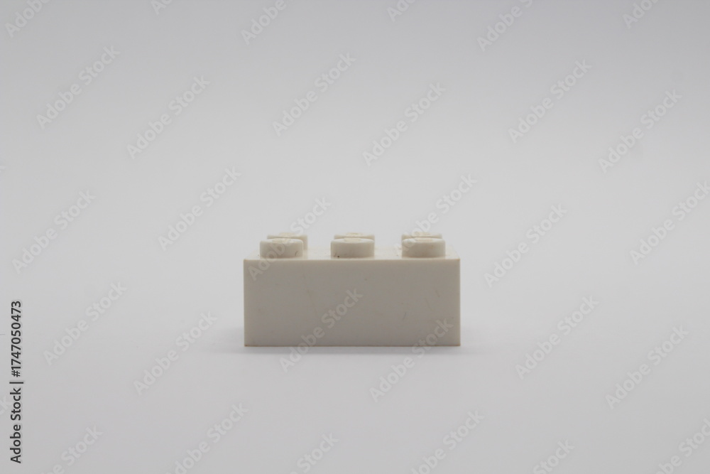 Obraz premium White Lego brick piece isolated on a white background 