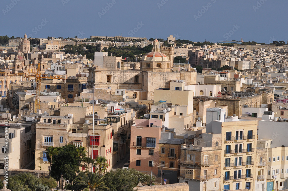 Fototapeta premium View of old building with windows, balconies in city. Republic of Malta, the picturesque city of Valetta, Malta.